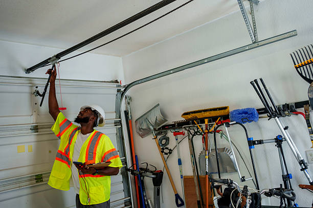 Professional Garage Door Panel Replacement technician working in Clatskanie, OR